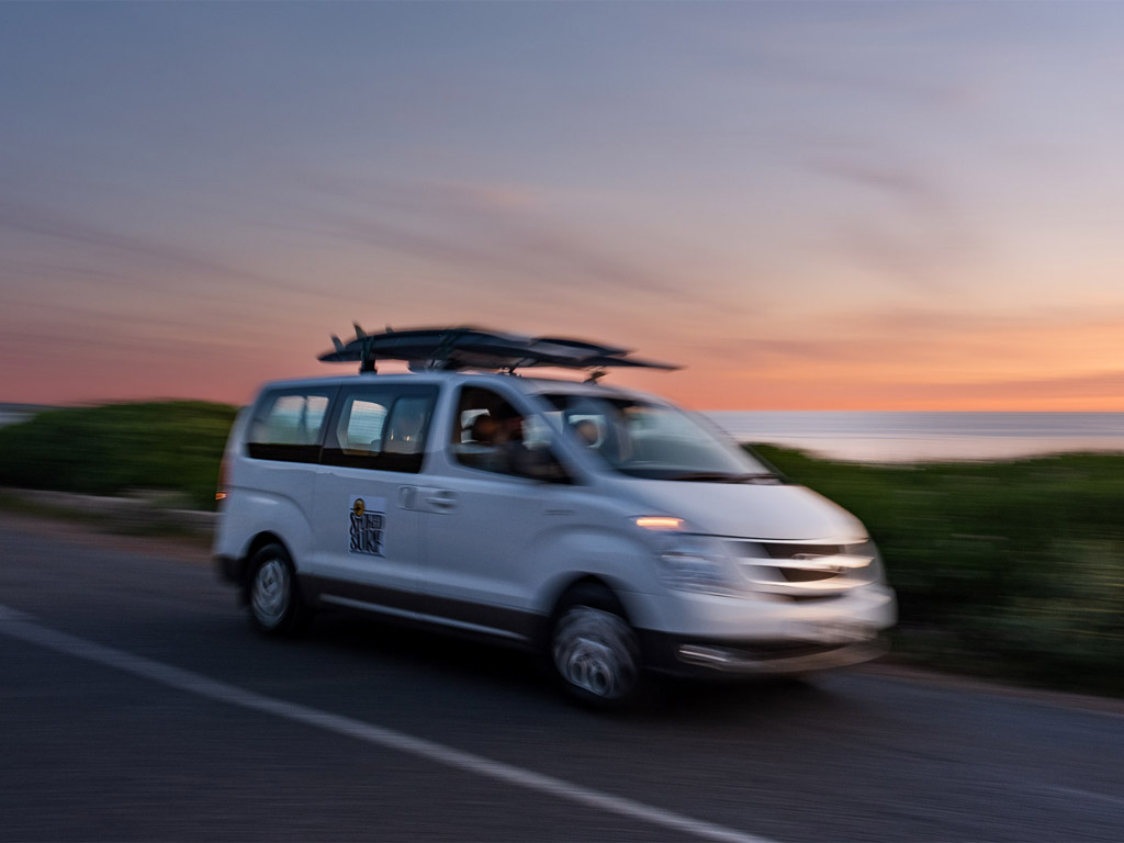 ss-why-mobile-suft-blog-post-img2 Stoked Surf van driving by on the Cape Town road