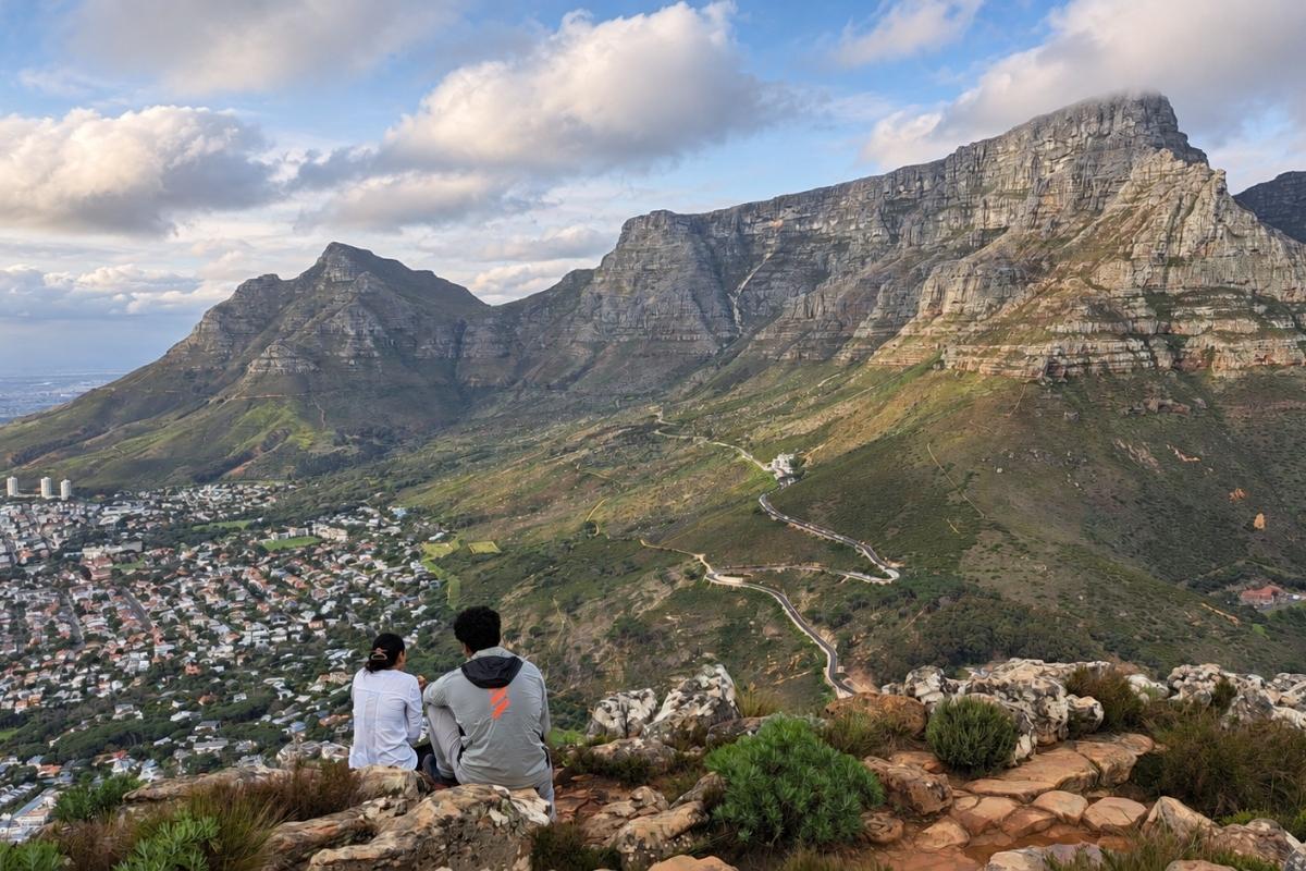 Guests hiking Lion's Head during a private Cape Town surf and adventure package